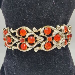 Gold Bracelet with Fiery Red Accents